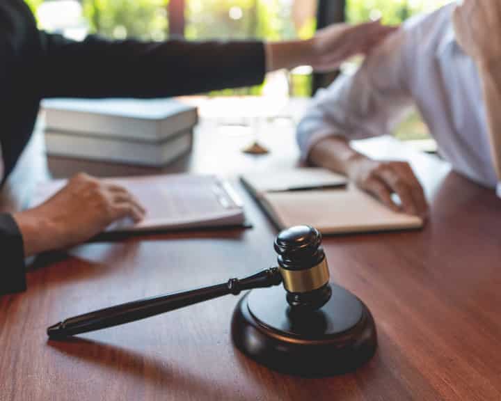 professional lawyer discussing legal options and solutions with a client in El Paso